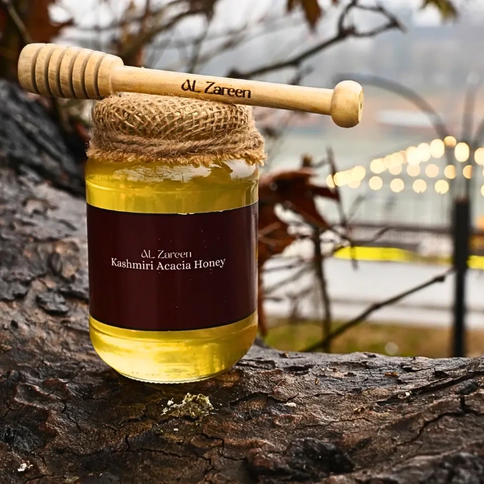 Al Zareen Kashmiri Acacia honey jar with dipper on tree branch