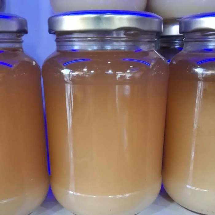 Jars of creamy white Kashmiri apple blossom honey, also called white cream honey, AL ZAREEN
