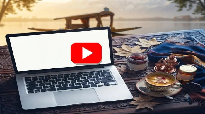 Kashmiri business owner working on laptop with online shop