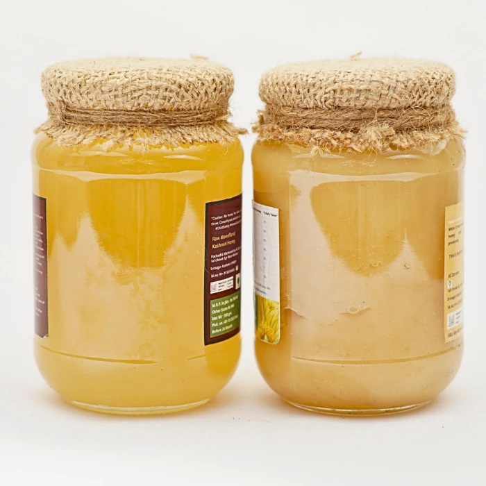 Two jars of AL ZAREEN honey side by side